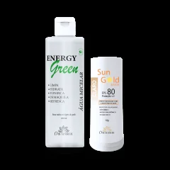 Frasco branco de água micelar Energy Green ao lado de um bastão de protetor solar Sun Gold FPS 80, tom claro, sobre fundo transparente