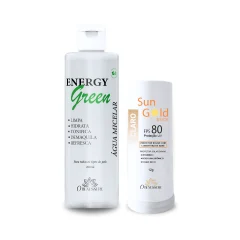 Frasco de água micelar ao lado de um bastão de protetor solar Sun Gold Stick FPS 80 no tom Claro